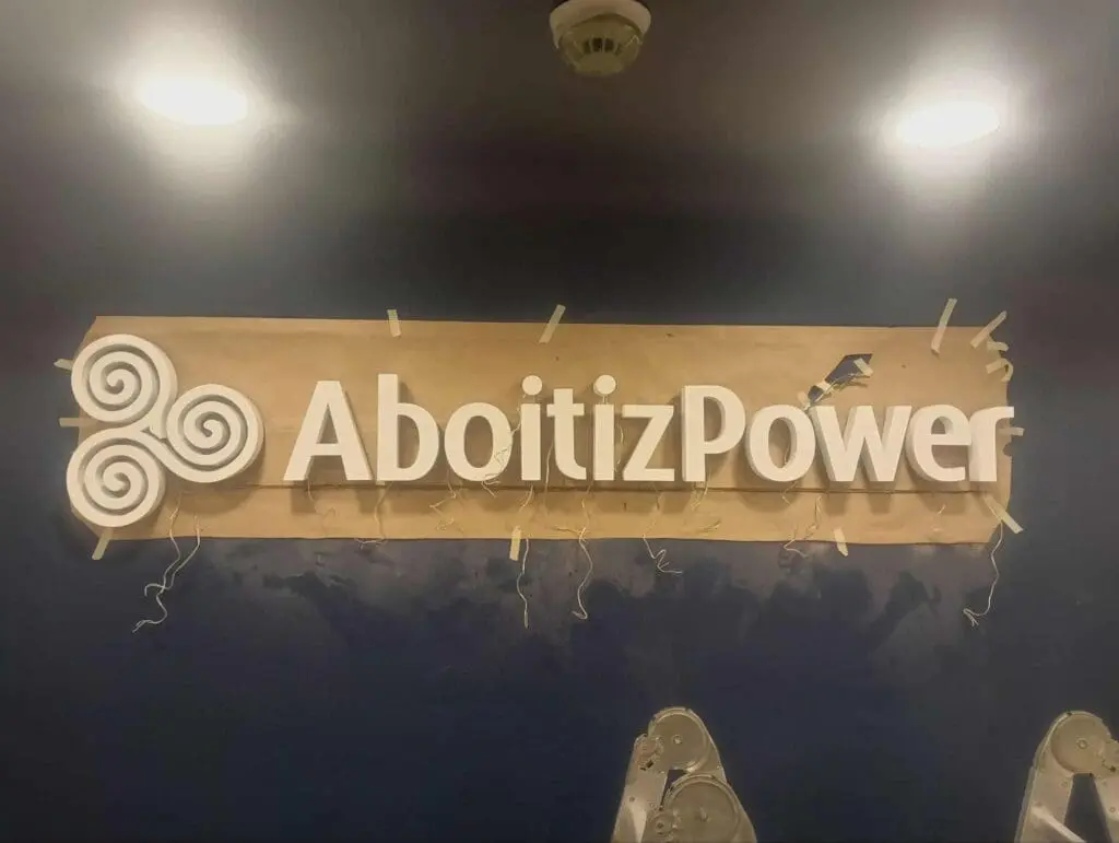 Acrylic indoor signage for AboitizPower partially covered, newly installed in the Philippines by sign maker Philippines, M&G Global Ads.