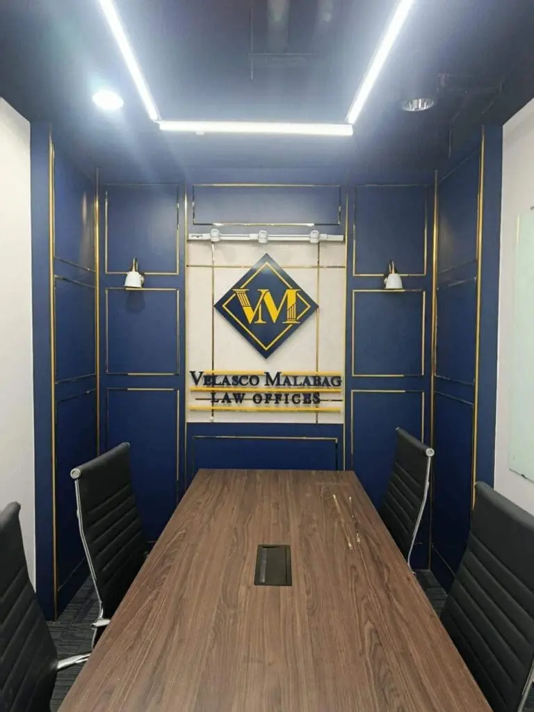 Indoor acrylic signage for Velasco Malabag Law Offices, blue accent wall, Metro Manila, sign maker Philippines by M&G Global Ads.