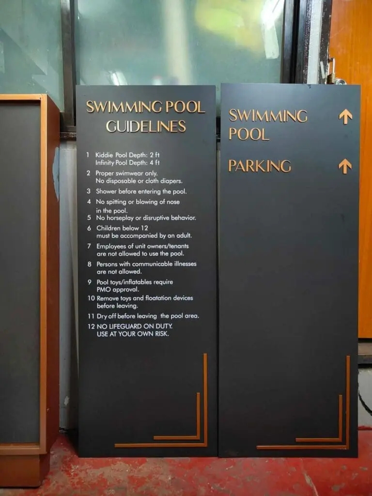 Outdoor acrylic swimming pool safety and parking signage, black with orange and white text, Metro Manila, sign maker Philippines by M&G Global Ads.