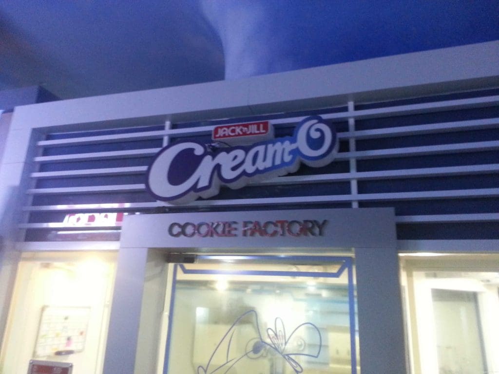 Jack n Jill Cream-O Cookie Factory lighted storefront signage in Makati with modern metallic and glass design by M&G Global Ads.