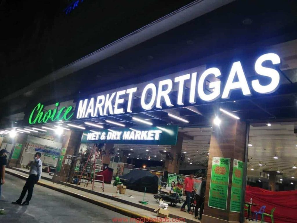 Illuminated storefront signage for Choice Market Ortigas and Wet & Dry Market in Makati at night by M&G Global Ads.