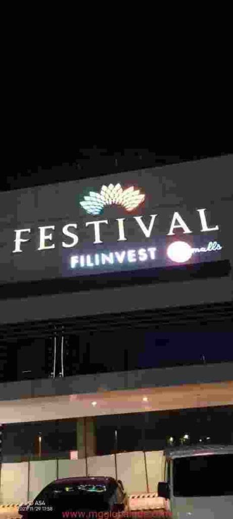 LED signage for Festival Filinvest Malls with lotus logo at night, cars below, Ortigas location by M&G Global Ads.