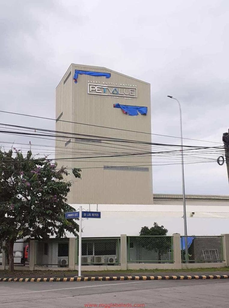 PETVALUE storefront signage installation with partially covered sign on beige building in Ortigas by M&G Global Ads.