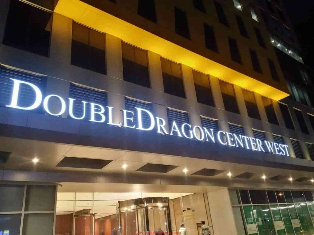 DoubleDragon Center West illuminated building signage in Mandaluyong, night view with entrance, by M&G Global Ads.