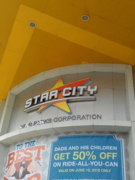 Star City entrance acrylic signage with yellow star logo and promo banner in Quezon City by M&G Global Ads.