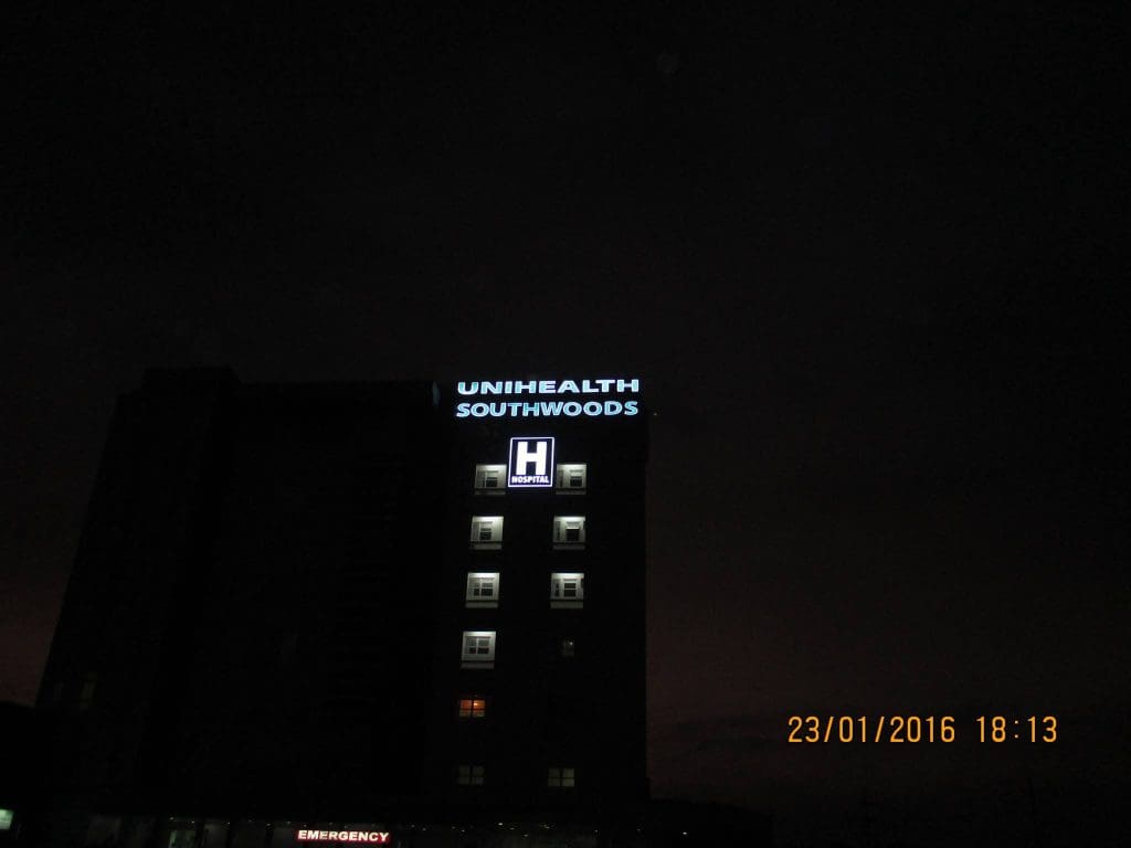 Hospital LED signage for UNHEALTH SOUTHWOODS, H HOSPITAL in Quezon City at night by M&G Global Ads.