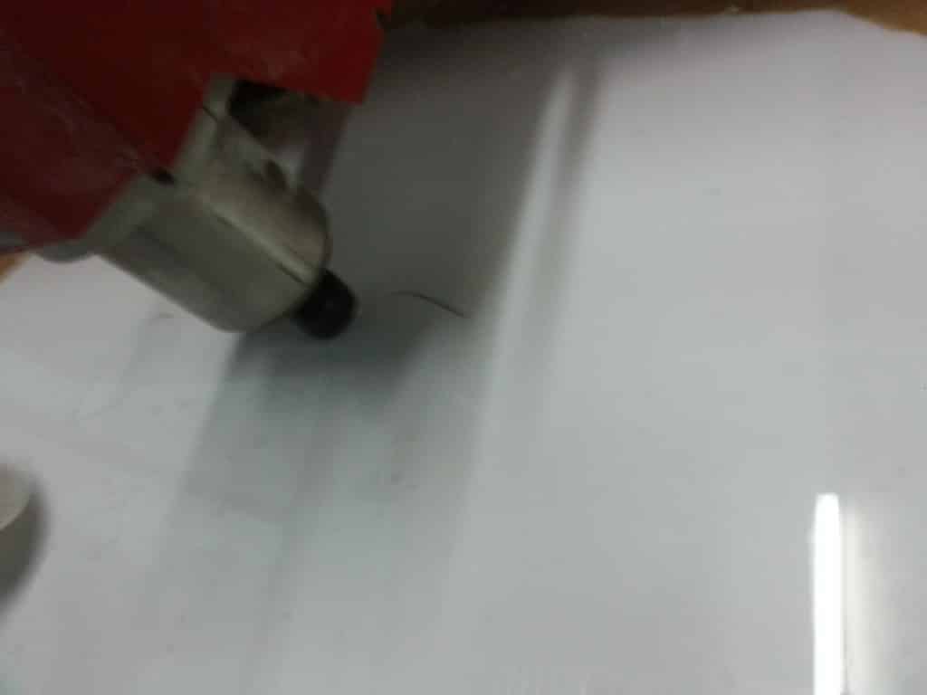 CNC machine cutting acrylic for custom building signage in Quezon City, cutting tool left side—by M&G Global Ads.
