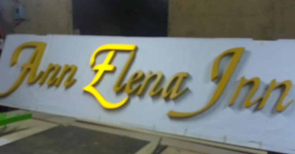 Gold cursive indoor signage for Ann Elena Inn with illuminated Elena lettering, Metro Manila by M&G Global Ads.