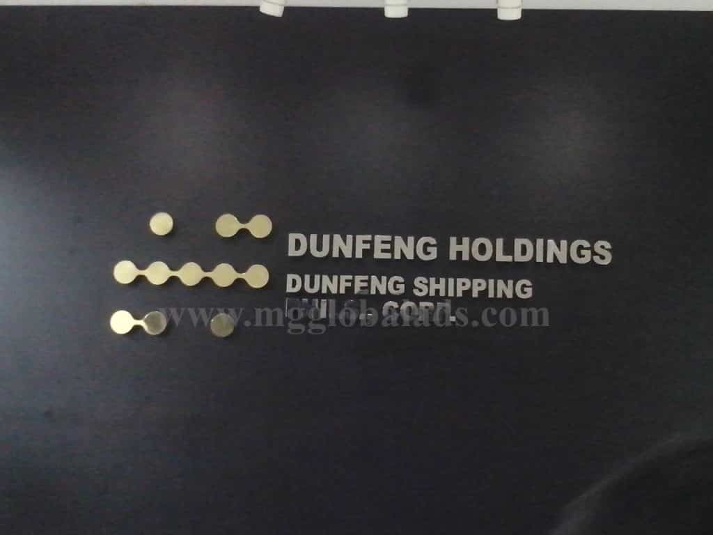 Building signage for Dunfeng Holdings and Dunfeng Shipping in Ortigas, gold and silver style, by M&G Global Ads.