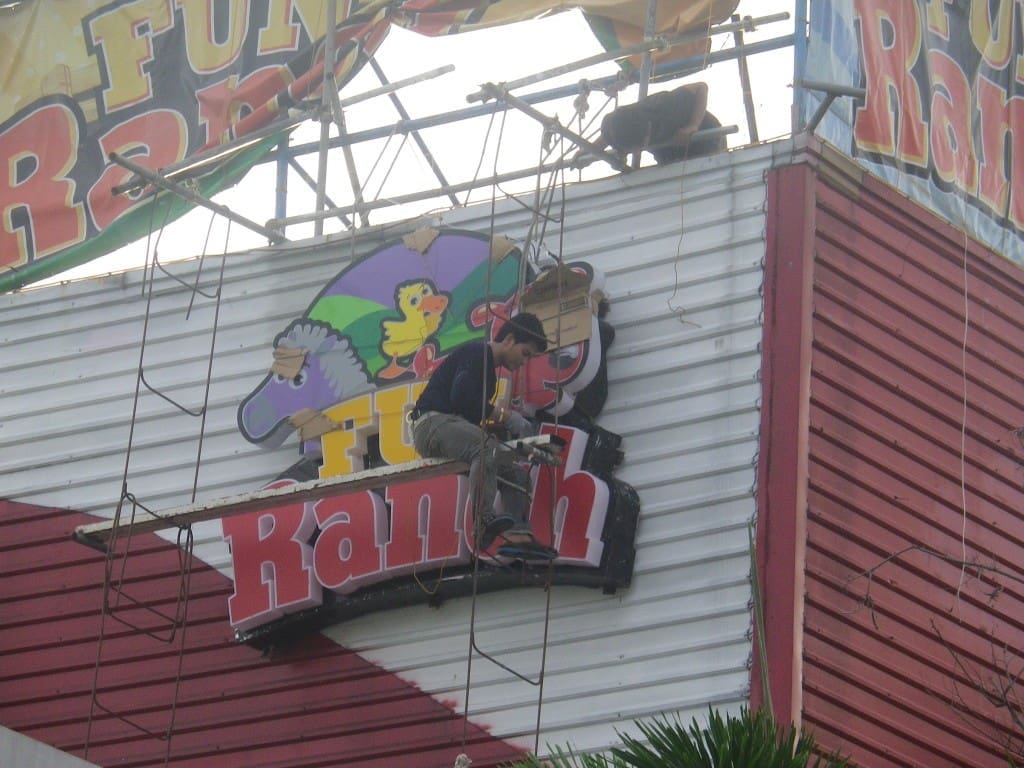 LED signage installation for Fun Ranch at Ortigas with cartoon animals, done by a skilled worker—by M&G Global Ads.