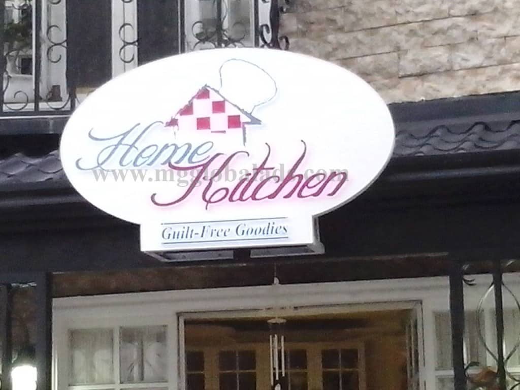 Home Kitchen oval building signage, red checkered roof logo, Guilt-Free Goodies slogan in Makati by M&G Global Ads.