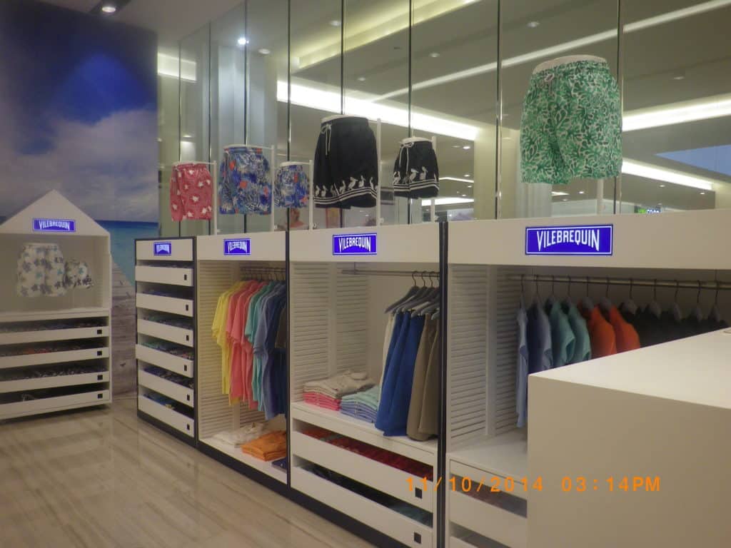 Acrylic signage for Vilebrequin in Makati store with colorful swim trunks, modern fixtures, beach wall—by M&G Global Ads.