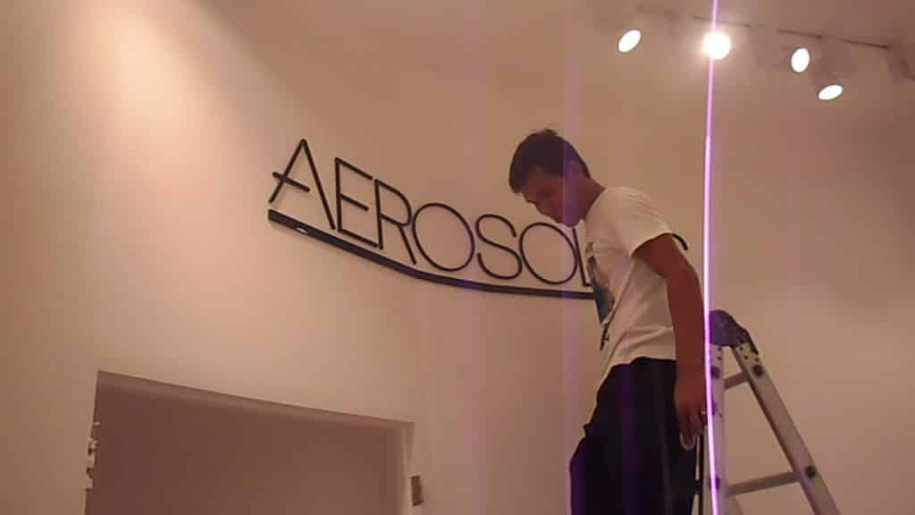 Building signage installation for AEROSOL client in Makati, large letters under bright lights by M&G Global Ads.