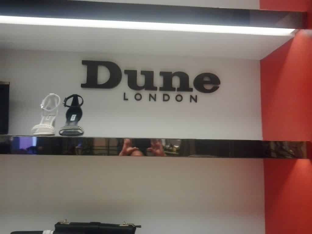 LED signage for Dune London in Makati, featuring black and white high-heeled sandals display, by M&G Global Ads.