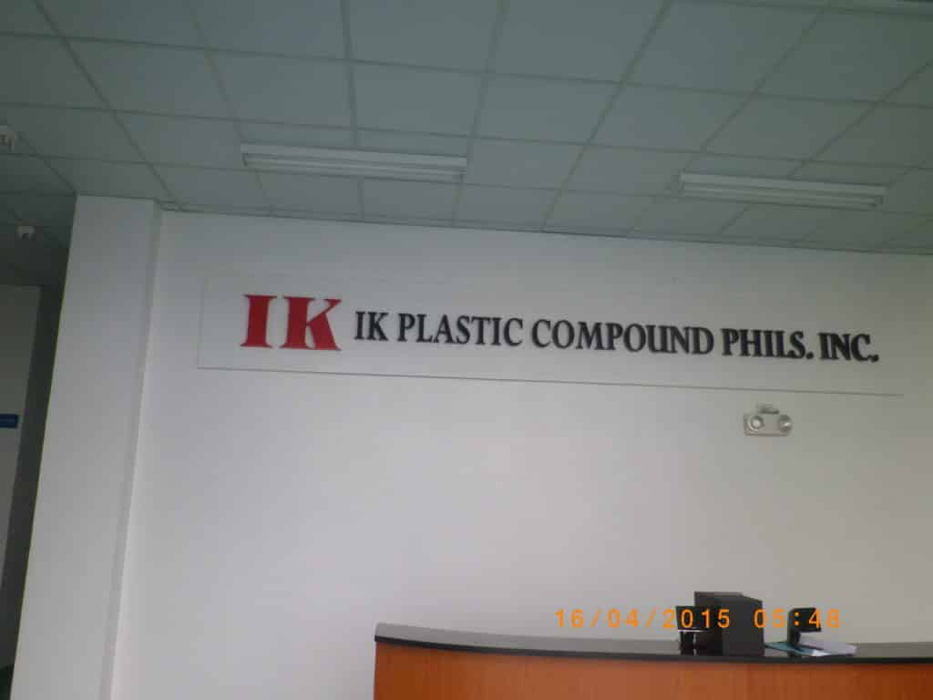 Acrylic signage for IK PLASTIC COMPOUND PHILS. INC., lobby wall, Quezon City office, by M&G Global Ads.