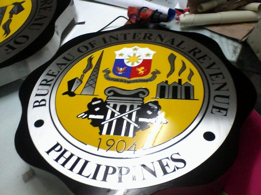 BIR indoor signage seal for Bureau of Internal Revenue, Makati, black and yellow design by M&G Global Ads.