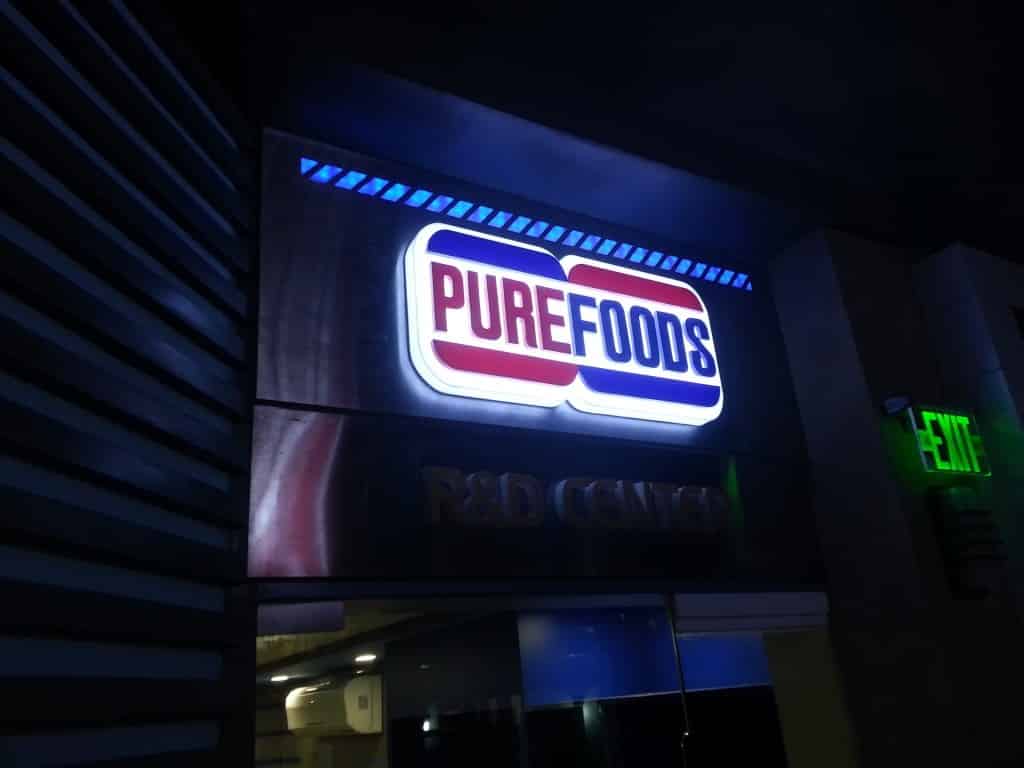 PUREFOODS LED signage for R&D CENTER at night in Mandaluyong, with EXIT sign nearby, by M&G Global Ads.