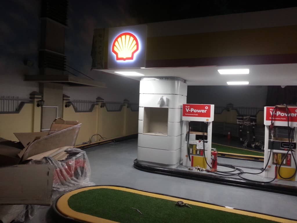 Shell gas station with LED signage and V-Power pumps at night in Makati, under construction. Signage by M&G Global Ads.