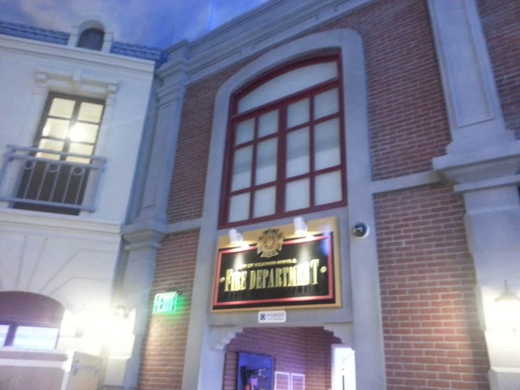 Fire Department outdoor signage on red brick facade with arched window in Makati, illuminated exit sign by M&G Global Ads.