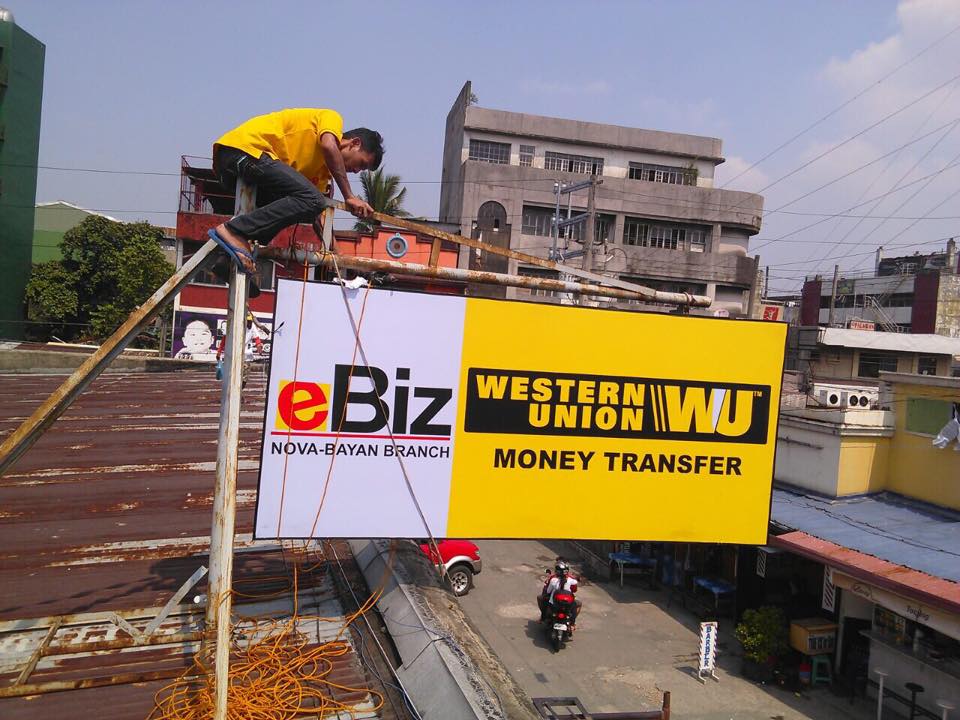 Acrylic rooftop signage installation for eBiz and Western Union Money Transfer in Pasig by M&G Global Ads.