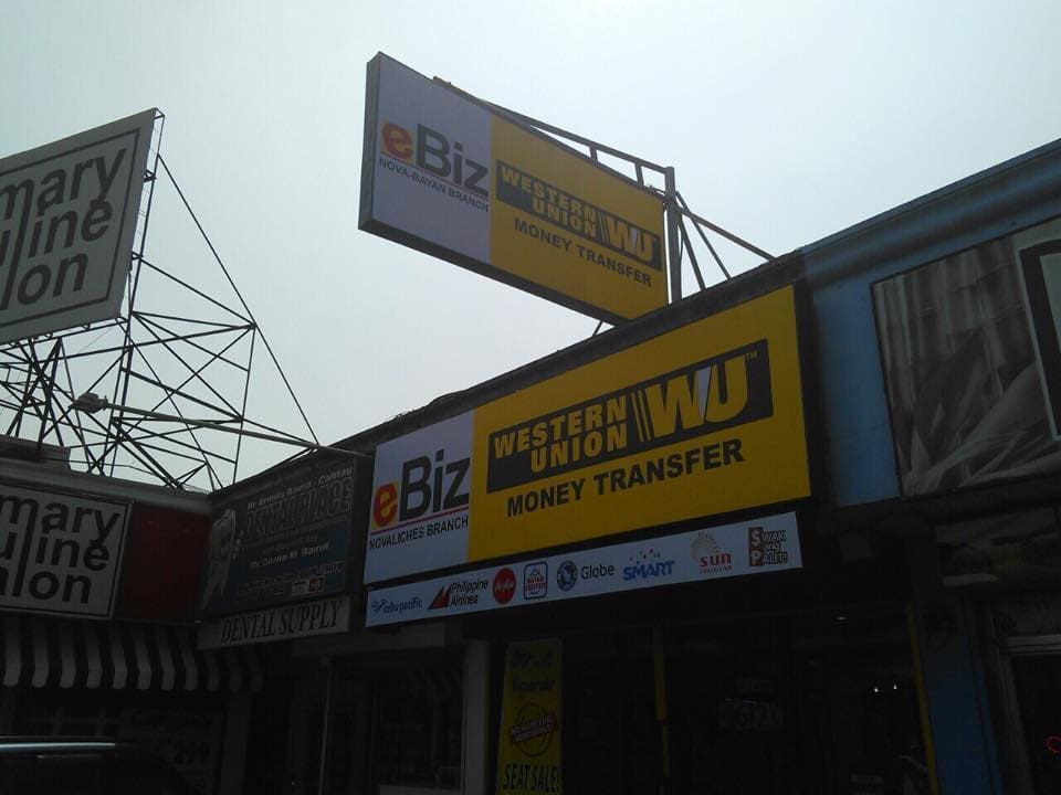Western Union Money Transfer outdoor signage and eBiz sign in front of a Makati store by M&G Global Ads.