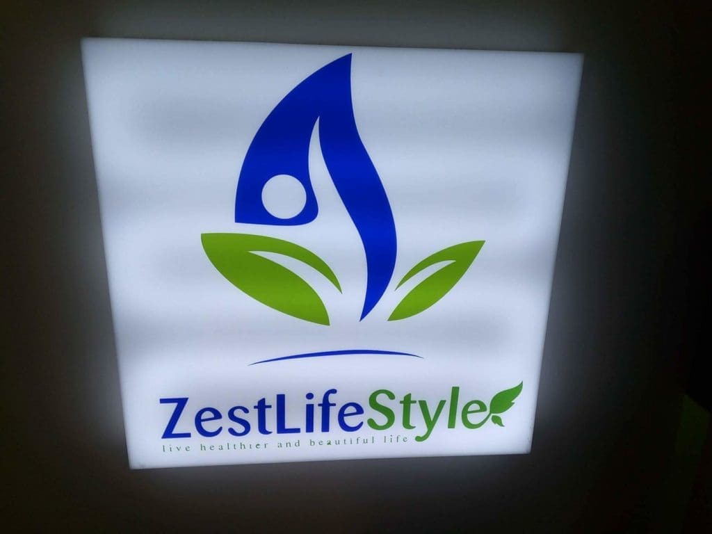 Acrylic signage for ZestLifeStyle, blue and green logo, tagline live healthier and beautiful life in Makati by M&G Global Ads.