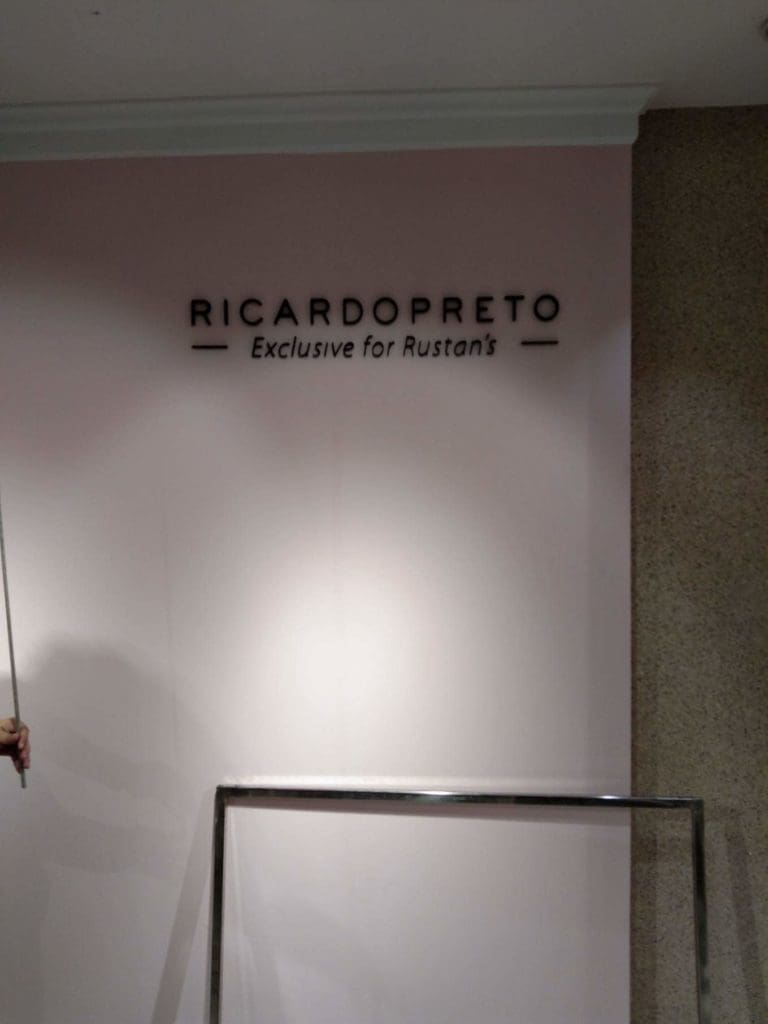 LED signage for Rustans store, featuring RICARDO PRETO, on a pale pink wall in Makati by M&G Global Ads.
