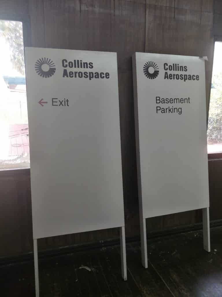 Acrylic directional signage for Collins Aerospace in Makati, showing Exit and Basement Parking. Minimal indoor design by M&G Global Ads.