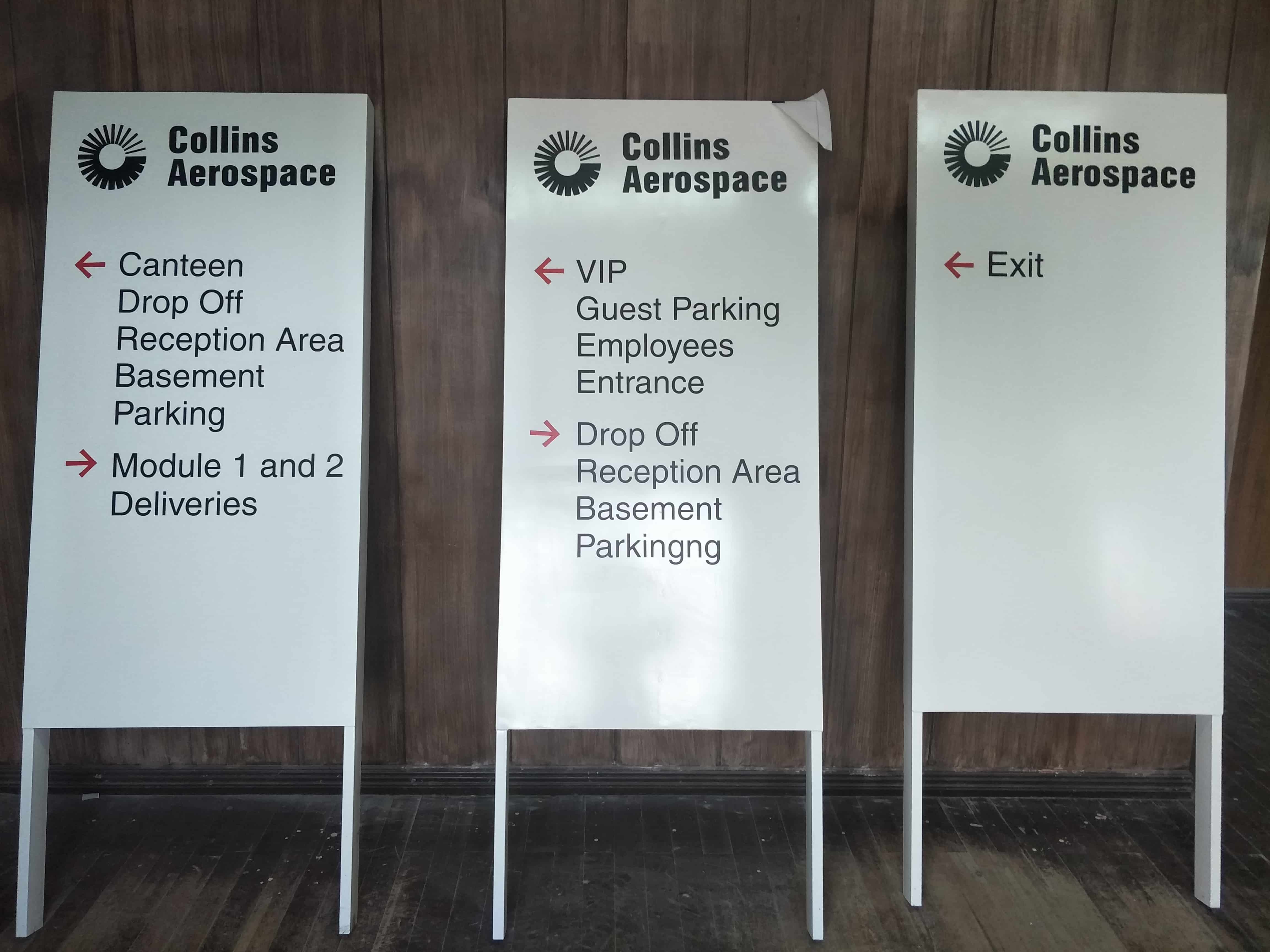 Collins Aerospace wayfinding signage in Makati with black text, logos, red arrows for directions by M&G Global Ads.