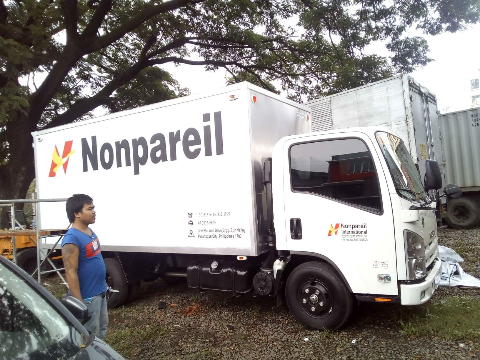 Nonpareil International delivery truck with acrylic signage in Mandaluyong, featuring logo and contact info by M&G Global Ads.