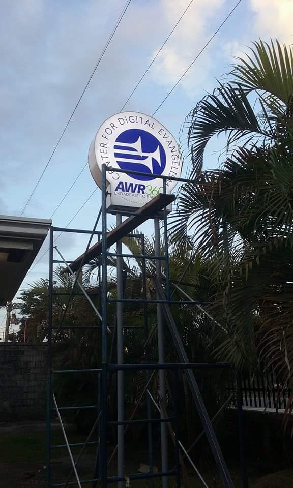 Acrylic round signage for Center for Digital Evangelism and AWR360° in Quezon City with boat logo by M&G Global Ads.