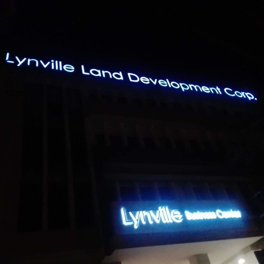LED signage for Lynville Land Development Corp. and Lynville Business Center in Makati building at night by M&G Global Ads.