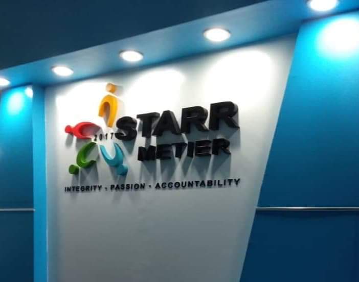 STARR METIER metallic wall signage, illuminated in Makati office; colorful abstract logo and values displayed by M&G Global Ads.