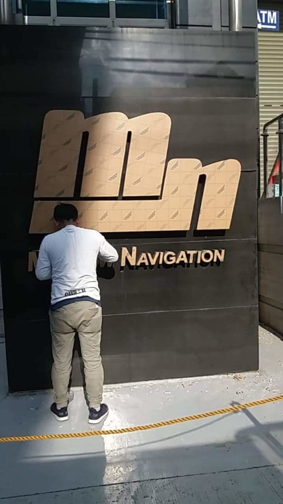 Outdoor building signage installation for NAVIGATION, metallic channel letters in Mandaluyong by M&G Global Ads.