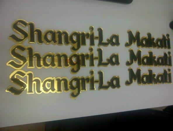 brass signage for Shangri-La Makati in BGC with gold 3D cut-out letters and bold shadows, by M&G Global Ads.