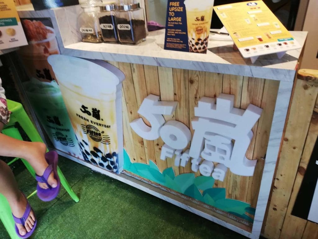 Bubble tea shop counter with 50嵐 Fiftea acrylic signage and menu in Makati, plus drinks photos, by M&G Global Ads.