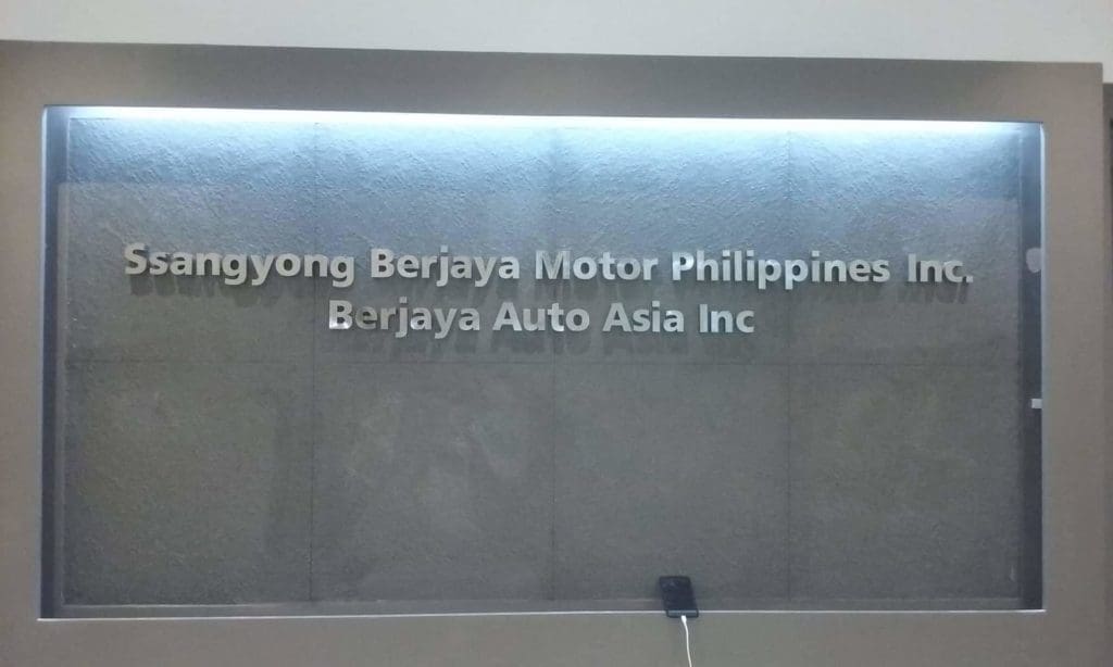 Stainless indoor corporate sign for Ssangyong Berjaya Motor Philippines, Ortigas, with security device by M&G Global Ads.