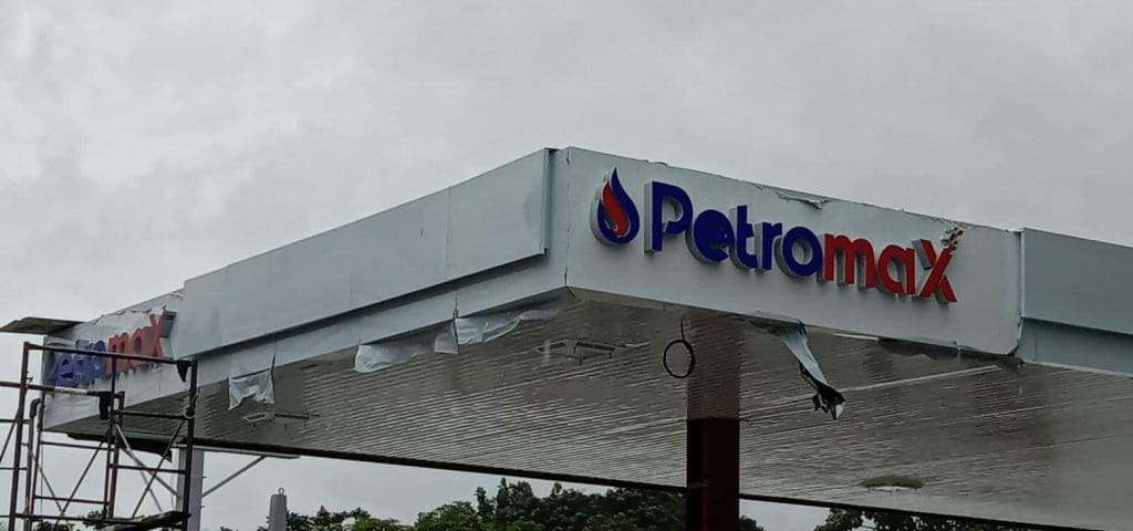 Petromax gas station canopy outdoor signage Makati with logo, red-blue lettering, construction materials by M&G Global Ads.