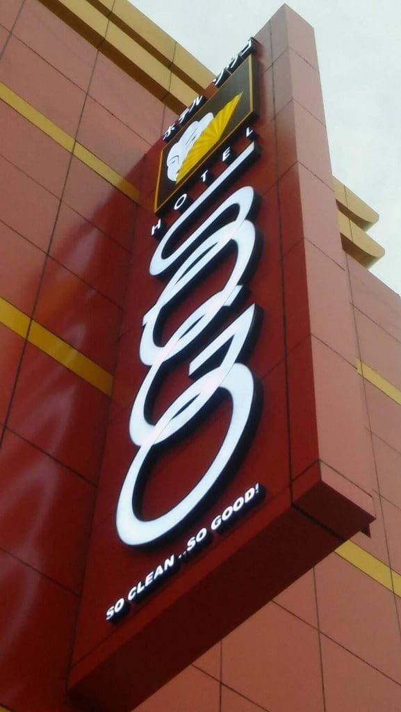 LED hotel signage for HOTEL 808 with tagline, modern red/yellow facade, in Ortigas by M&G Global Ads.