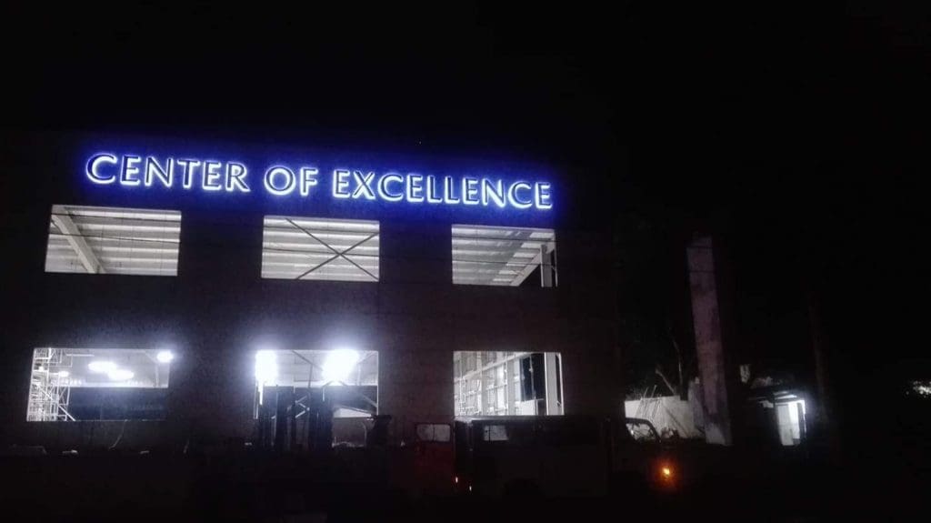 Illuminated LED signage CENTER OF EXCELLENCE at night, building in Ortigas, by M&G Global Ads.