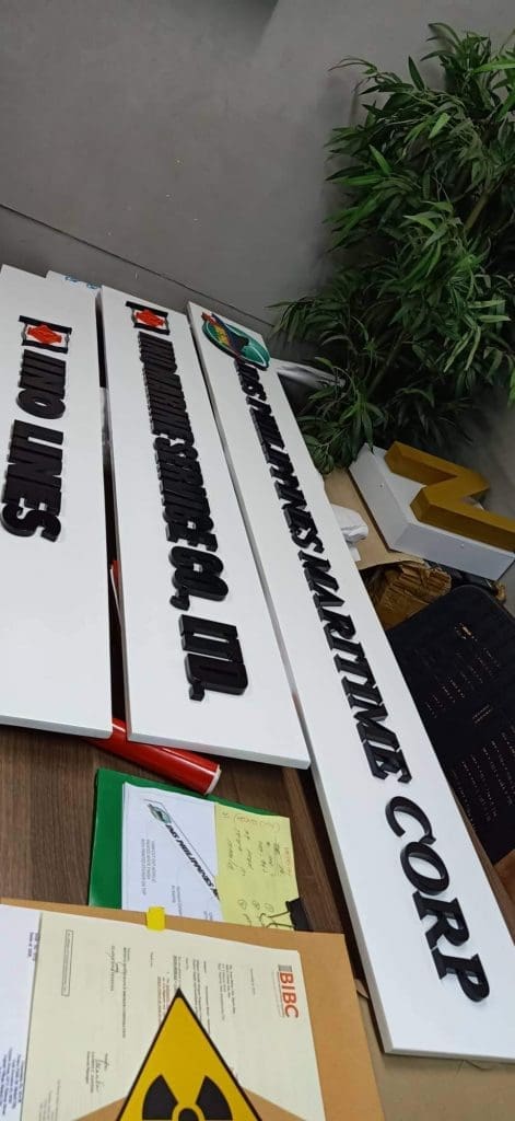 Metallic 3D nameplates signage for PANDIMES MARITIME CORP on office desk in BGC by M&G Global Ads.