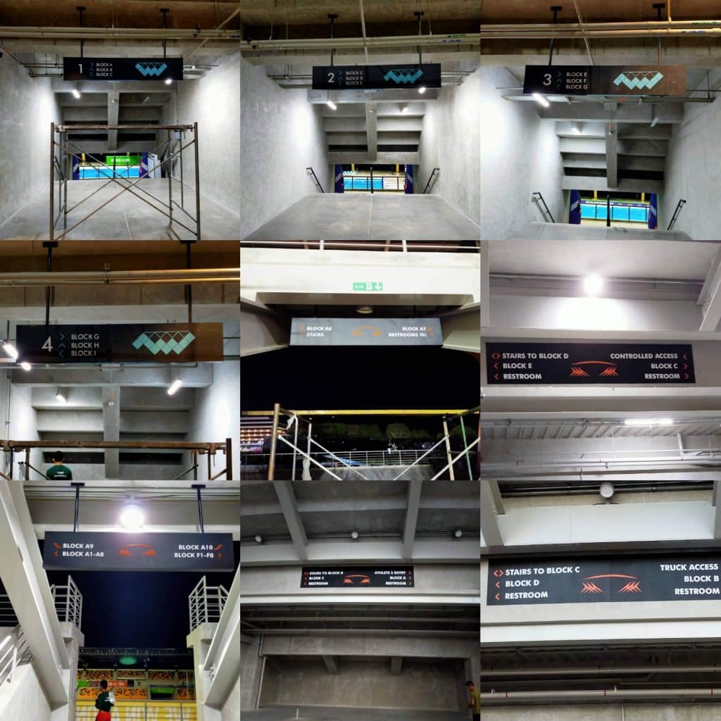 Acrylic directional and stadium signage for seating and restrooms at a concrete venue in Quezon City by M&G Global Ads.