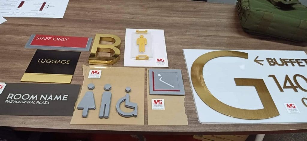 Indoor signage samples: restroom signs, STAFF ONLY, LED buffet sign, metallic ROOM NAME in Makati by M&G Global Ads.