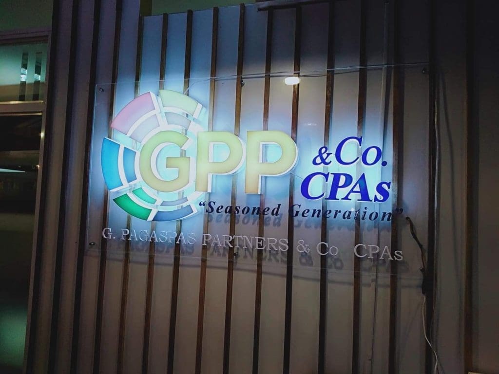 Illuminated acrylic signage for G. Pagaspas Partners & Co. CPAs in Makati by M&G Global Ads, with colorful logo and tagline.