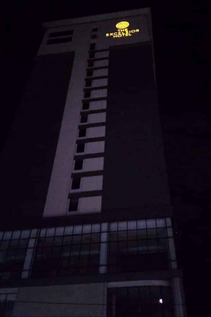 Illuminated acrylic signage for HOTEL EXCELSIOR atop a tall building in Makati at night, by M&G Global Ads.