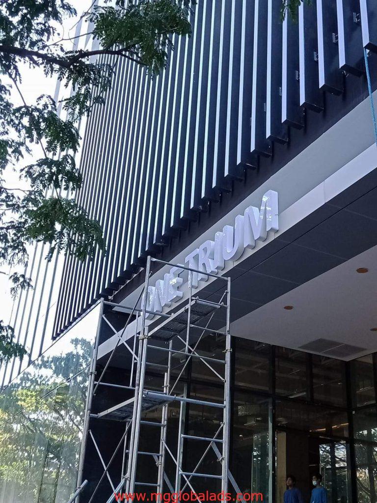 one trium | sign maker | building signage