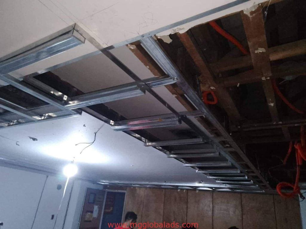LED signage-inspired ceiling light installation in a Makati office under construction by M&G Global Ads.