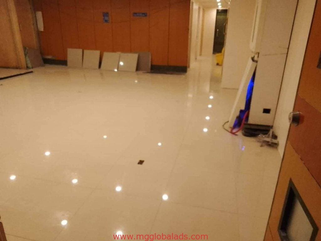 Indoor signage installation room with white tile floors and wooden walls in Quezon City by M&G Global Ads.