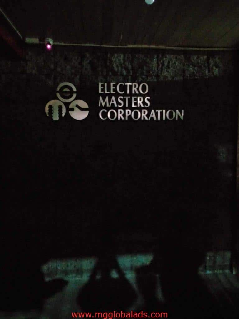 Indoor acrylic signage for ELECTRO MASTERS CORPORATION with logo, dimly lit, Makati location, by M&G Global Ads.
