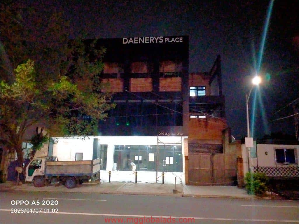 LED outdoor signage for Daenerys Place on a building facade in Makati at night, by M&G Global Ads.